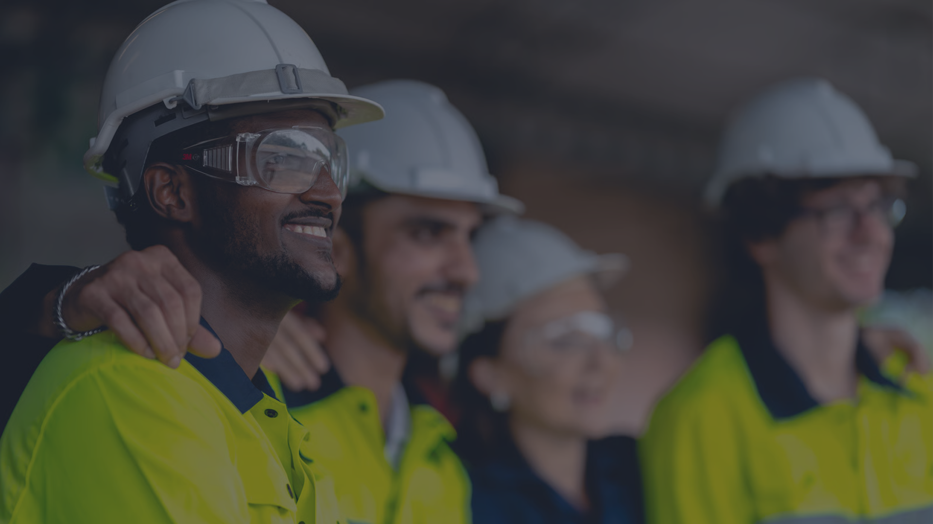 A construction safety manager in a yellow hard hat reviews verified worker attendance on a tablet at a jobsite gate, with the data syncing into a project management dashboard, illustrating how BiltOn closes the safety data gap.